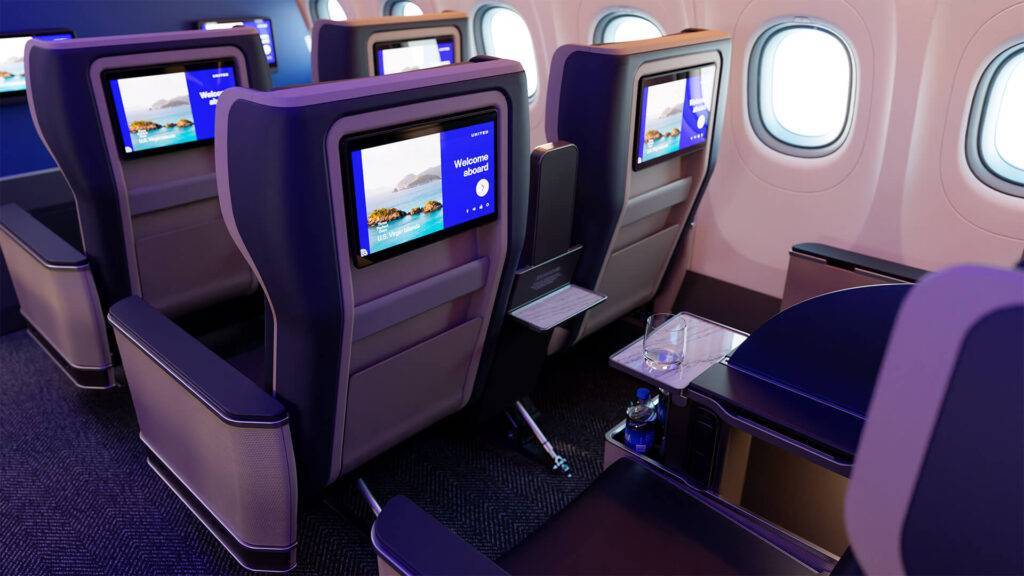 United Airlines A321neo cabin interior, back of seats with trays folded away